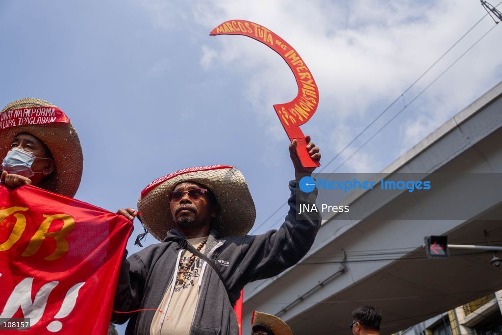 MANILA, PHILIPPINES - OCTOBER 21, 2026: Farmers and agricultural workers march toward the Mendiola Peace Arch, near the presidential palace, to call for agrarian reform during Peasant Month, observed every October in the Philippines. Protesters, including farmers from Central Luzon, are asking the government for aid as they face the effects of climate change and rising food demand. (Photo by Charles Edmon S. Perez/JNA Press via Nexpher Images)