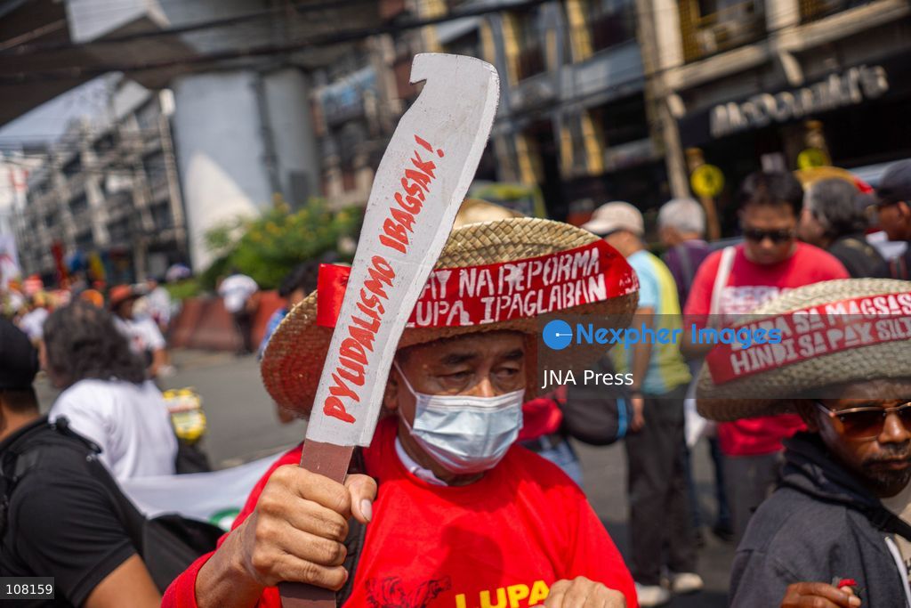MANILA, PHILIPPINES - OCTOBER 21, 2026: Farmers and agricultural workers march toward the Mendiola Peace Arch, near the presidential palace, to call for agrarian reform during Peasant Month, observed every October in the Philippines. Protesters, including farmers from Central Luzon, are asking the government for aid as they face the effects of climate change and rising food demand. (Photo by Charles Edmon S. Perez/JNA Press via Nexpher Images)
