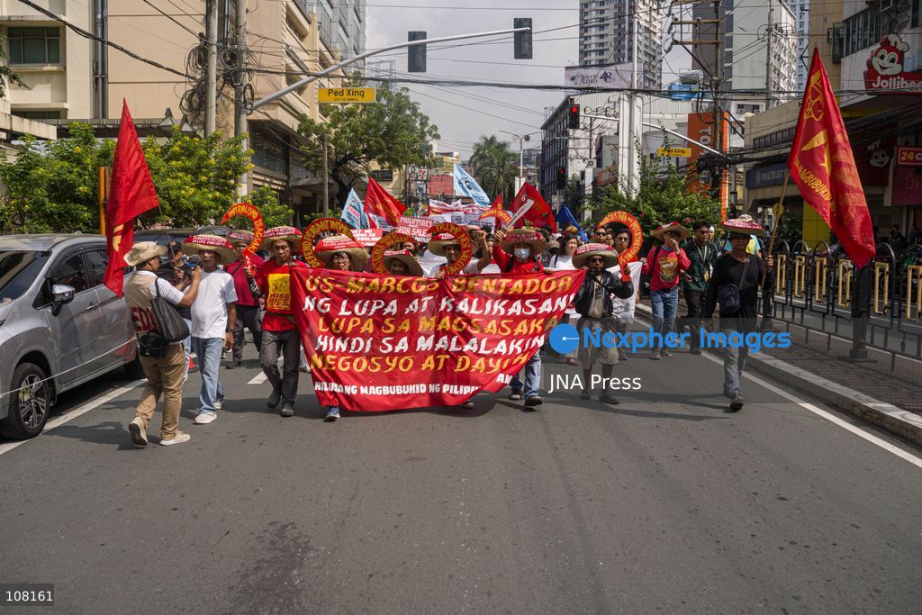 MANILA, PHILIPPINES - OCTOBER 21, 2026: Farmers and agricultural workers march toward the Mendiola Peace Arch, near the presidential palace, to call for agrarian reform during Peasant Month, observed every October in the Philippines. Protesters, including farmers from Central Luzon, are asking the government for aid as they face the effects of climate change and rising food demand. (Photo by Charles Edmon S. Perez/JNA Press via Nexpher Images)