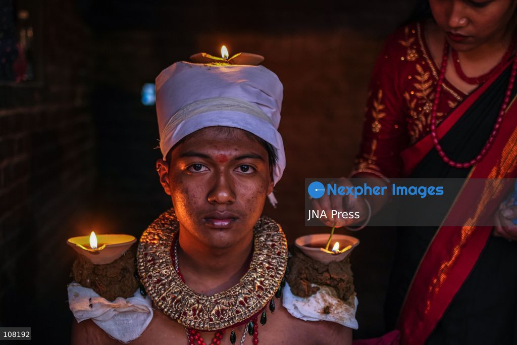 BHAKTAPUR, NEPAL - OCTOBER 21, 2026: Hindu devotees perform a religious ritual by lighting oil lamps on their bodies at Brahmayani Temple during the Dashain festival, marking Vijaya Dashami, the tenth day of Dashain, Nepal's biggest Hindu festival. (Photo by Ambir Tolang/JNA Press via Nexpher Images)