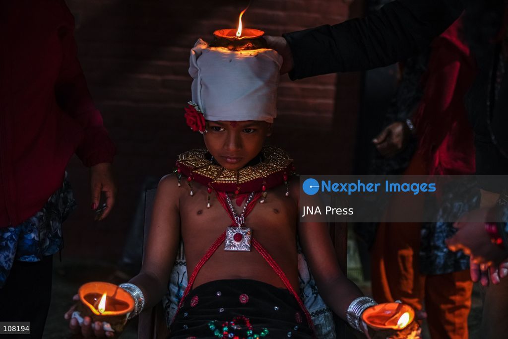 BHAKTAPUR, NEPAL - OCTOBER 21, 2026: Hindu devotees perform a religious ritual by lighting oil lamps on their bodies at Brahmayani Temple during the Dashain festival, marking Vijaya Dashami, the tenth day of Dashain, Nepal's biggest Hindu festival. (Photo by Ambir Tolang/JNA Press via Nexpher Images)