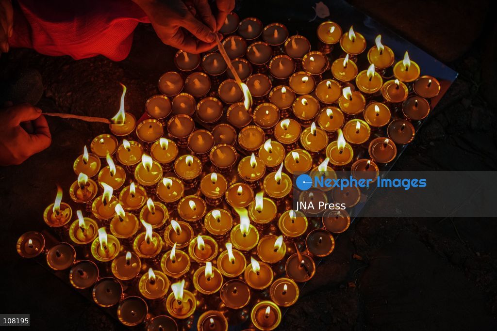 BHAKTAPUR, NEPAL - OCTOBER 21, 2026: Hindu devotees perform a religious ritual by lighting oil lamps on their bodies at Brahmayani Temple during the Dashain festival, marking Vijaya Dashami, the tenth day of Dashain, Nepal's biggest Hindu festival. (Photo by Ambir Tolang/JNA Press via Nexpher Images)