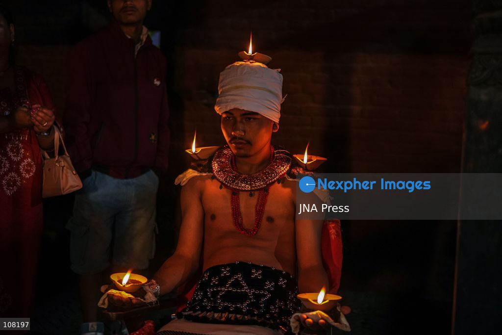 BHAKTAPUR, NEPAL - OCTOBER 21, 2026: Hindu devotees perform a religious ritual by lighting oil lamps on their bodies at Brahmayani Temple during the Dashain festival, marking Vijaya Dashami, the tenth day of Dashain, Nepal's biggest Hindu festival. (Photo by Ambir Tolang/JNA Press via Nexpher Images)
