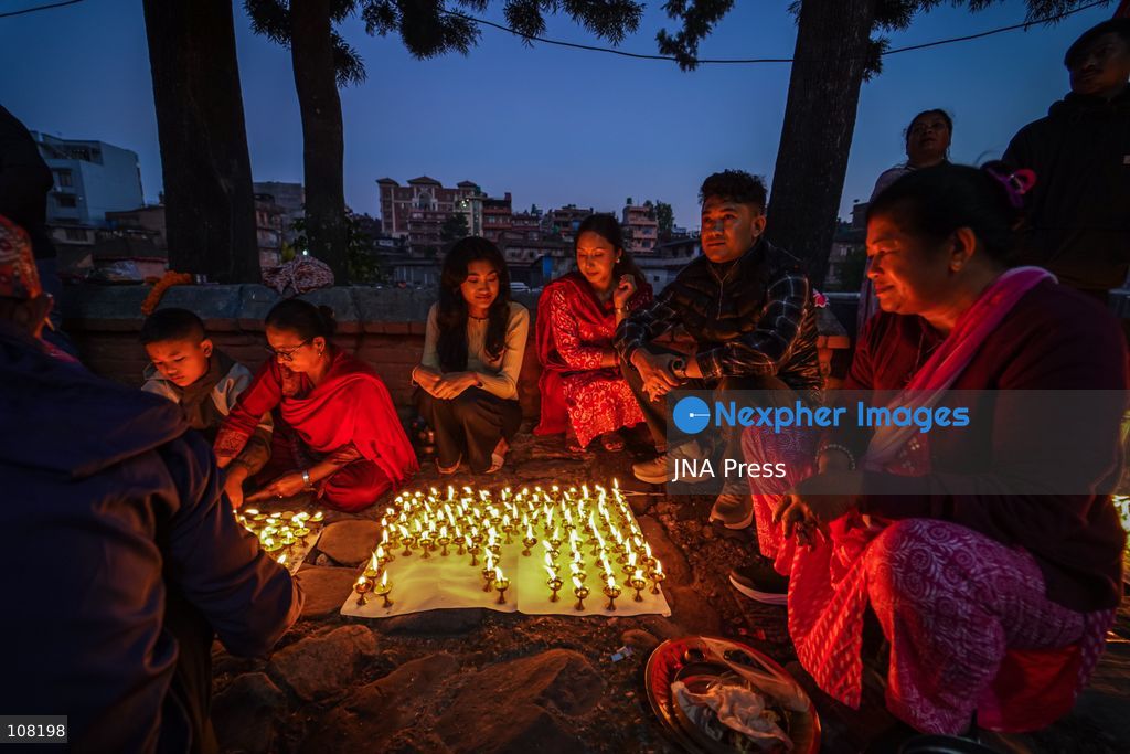 BHAKTAPUR, NEPAL - OCTOBER 21, 2026: Hindu devotees perform a religious ritual by lighting oil lamps on their bodies at Brahmayani Temple during the Dashain festival, marking Vijaya Dashami, the tenth day of Dashain, Nepal's biggest Hindu festival. (Photo by Ambir Tolang/JNA Press via Nexpher Images)