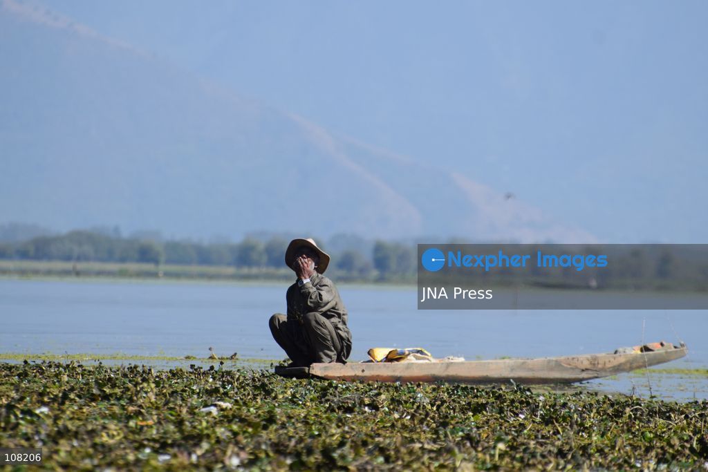 BANDIPORA, JAMMU AND KASHMIR, INDIA - OCTOBER 20, 2026: Local residents harvest water chestnuts in the wetlands. The traditional harvest is a source of livelihood for local communities that depend on these wetlands. (Photo by Mohsin Mushtaq Bhat/JNA Press via Nexpher Images)