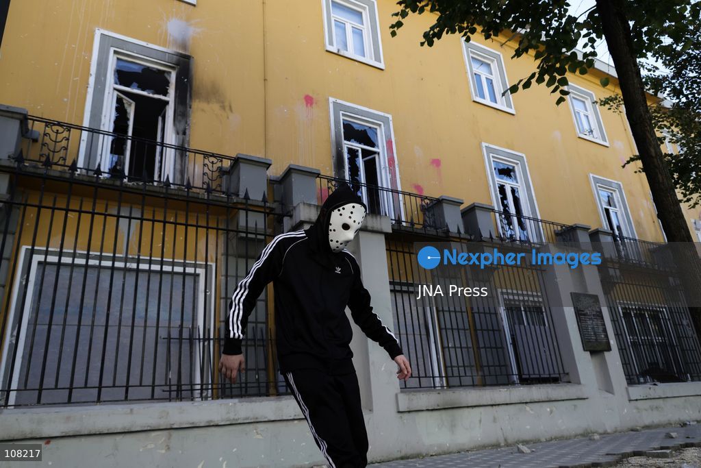 TOP PICS - TIRANA, ALBANIA - OCTOBER 20, 2026: Anti-government protests continue in Tirana for an eighth consecutive day, with demonstrators gathering in central areas of the capital, including Skanderbeg Square. Protesters call for the resignation of Prime Minister Edi Rama, demanding improvements to university conditions and broader political change. Tensions escalate as Albanian riot police fire tear gas to disperse demonstrators. One protester collapses in Skanderbeg Square after tear gas is deployed. Amid the confrontations, a young demonstrator is also seen reaching out to shake hands with a riot police officer, offering a contrasting moment during the tense demonstrations. The protests reflect growing public discontent and continued tensions between demonstrators and the authorities. (Photo by Vlasov Sulaj/JNA Press via Nexpher Images)