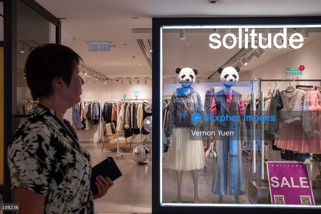 A woman walks pass a store with panda mannequins on display on October 21, 2026 in Hong Kong. (Photo by Vernon Yuen/Nexpher Images)