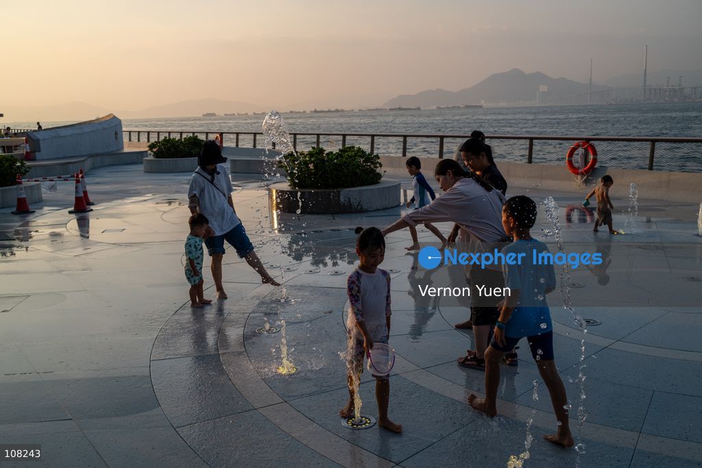 Children playing with water at a water playing area in a playground on October 21, 2026 in Hong Kong. (Photo by Vernon Yuen/Nexpher Images)
