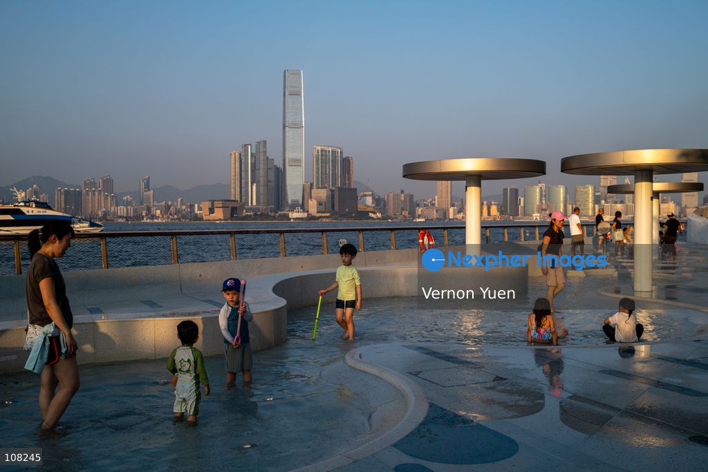 Children playing with water at a water playing area in a playground on October 21, 2026 in Hong Kong. (Photo by Vernon Yuen/Nexpher Images)