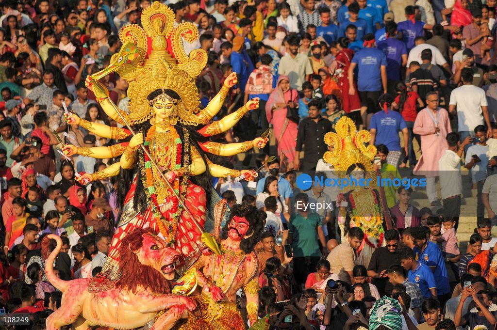 Hindu devotees immerse idols of the goddess Durga at Potenga Sea Beach, marking the conclusion of Durga Puja, one of the most important festivals in the Hindu calendar on October 21, 2026, in Chattogram, Bangladesh. (Photo by Md Rafayat Haque Khan/ Eyepix Group/Eyepix via Nexpher Images)