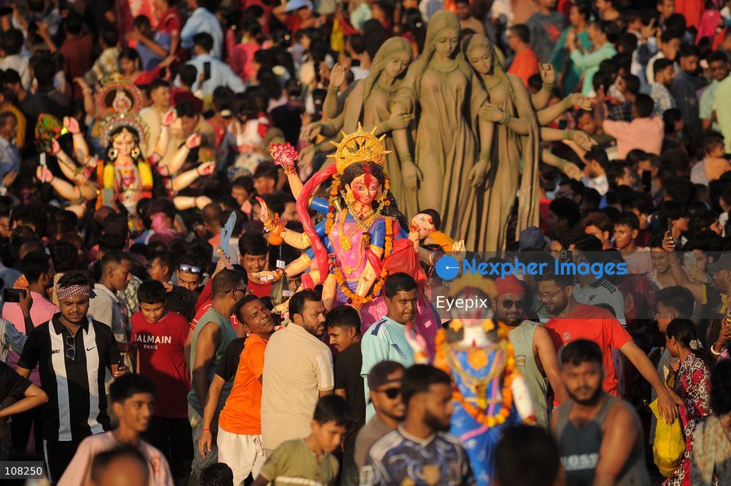 Hindu devotees immerse idols of the goddess Durga at Potenga Sea Beach, marking the conclusion of Durga Puja, one of the most important festivals in the Hindu calendar on October 21, 2026, in Chattogram, Bangladesh. (Photo by Md Rafayat Haque Khan/ Eyepix Group/Eyepix via Nexpher Images)