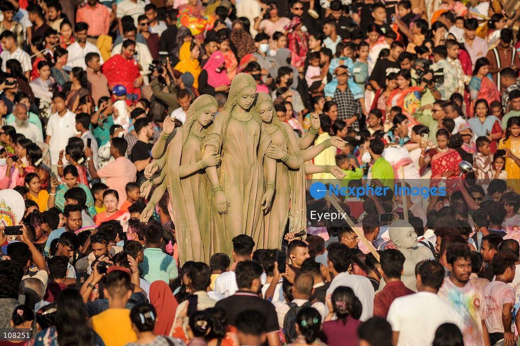 Hindu devotees immerse idols of the goddess Durga at Potenga Sea Beach, marking the conclusion of Durga Puja, one of the most important festivals in the Hindu calendar on October 21, 2026, in Chattogram, Bangladesh. (Photo by Md Rafayat Haque Khan/ Eyepix Group/Eyepix via Nexpher Images)