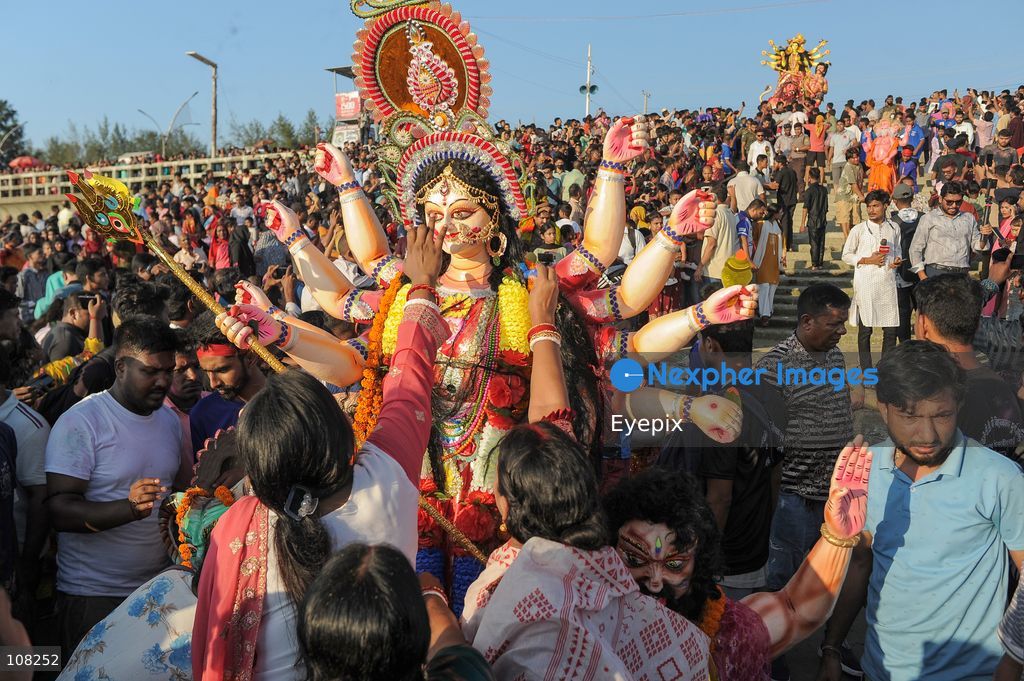Hindu devotees immerse idols of the goddess Durga at Potenga Sea Beach, marking the conclusion of Durga Puja, one of the most important festivals in the Hindu calendar on October 21, 2026, in Chattogram, Bangladesh. (Photo by Md Rafayat Haque Khan/ Eyepix Group/Eyepix via Nexpher Images)