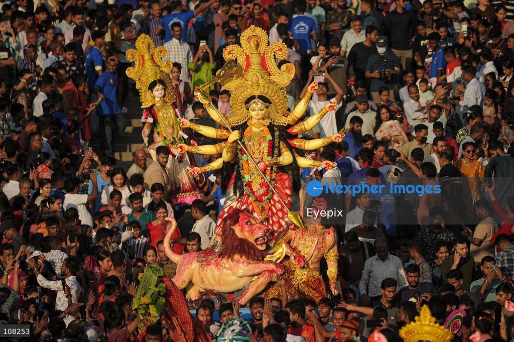 Hindu devotees immerse idols of the goddess Durga at Potenga Sea Beach, marking the conclusion of Durga Puja, one of the most important festivals in the Hindu calendar on October 21, 2026, in Chattogram, Bangladesh. (Photo by Md Rafayat Haque Khan/ Eyepix Group/Eyepix via Nexpher Images)