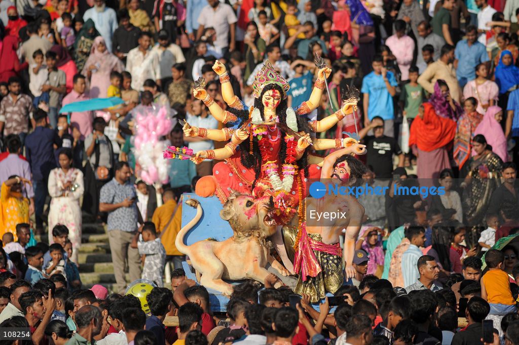 Hindu devotees immerse idols of the goddess Durga at Potenga Sea Beach, marking the conclusion of Durga Puja, one of the most important festivals in the Hindu calendar on October 21, 2026, in Chattogram, Bangladesh. (Photo by Md Rafayat Haque Khan/ Eyepix Group/Eyepix via Nexpher Images)