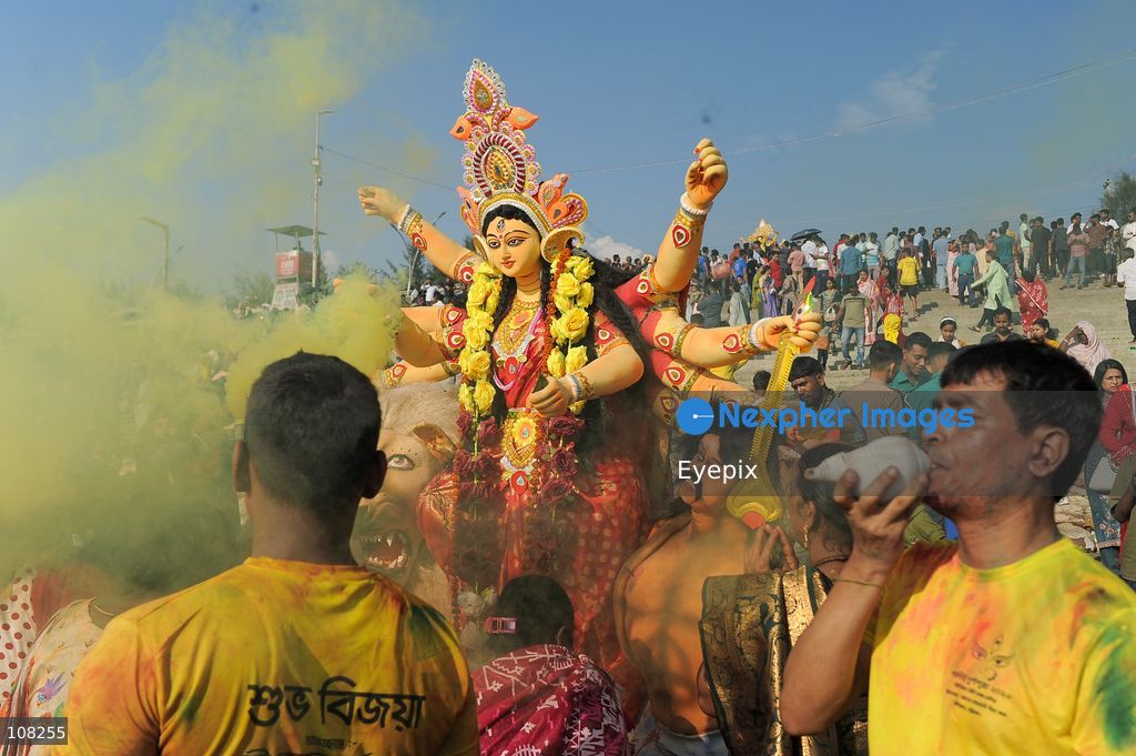Hindu devotees immerse idols of the goddess Durga at Potenga Sea Beach, marking the conclusion of Durga Puja, one of the most important festivals in the Hindu calendar on October 21, 2026, in Chattogram, Bangladesh. (Photo by Md Rafayat Haque Khan/ Eyepix Group/Eyepix via Nexpher Images)
