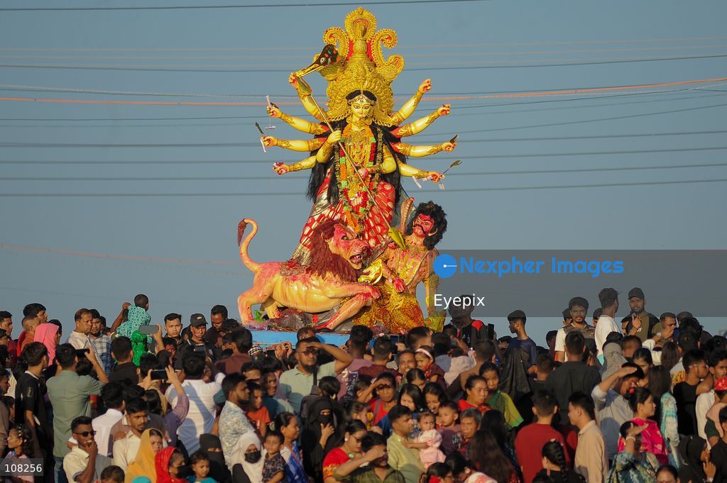Hindu devotees immerse idols of the goddess Durga at Potenga Sea Beach, marking the conclusion of Durga Puja, one of the most important festivals in the Hindu calendar on October 21, 2026, in Chattogram, Bangladesh. (Photo by Md Rafayat Haque Khan/ Eyepix Group/Eyepix via Nexpher Images)