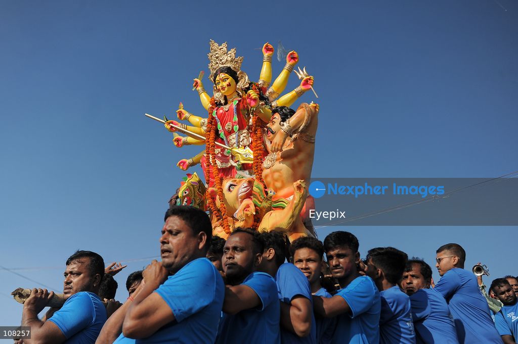 Hindu devotees immerse idols of the goddess Durga at Potenga Sea Beach, marking the conclusion of Durga Puja, one of the most important festivals in the Hindu calendar on October 21, 2026, in Chattogram, Bangladesh. (Photo by Md Rafayat Haque Khan/ Eyepix Group/Eyepix via Nexpher Images)