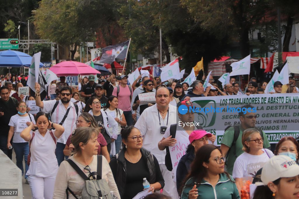 Healthcare workers belonging to the Mexican Social Security Institute (IMSS) protest to demand a direct pay raise based on the pay scale, a comprehensive supply of medical equipment and supplies, and the resignation of the General Secretary of the National Union of Social Security Workers (SNTSS). on October 21, 2026 in Mexico City, Mexico. (Photo by Carlos Santiago / Eyepix Group/Eyepix via Nexpher Images)