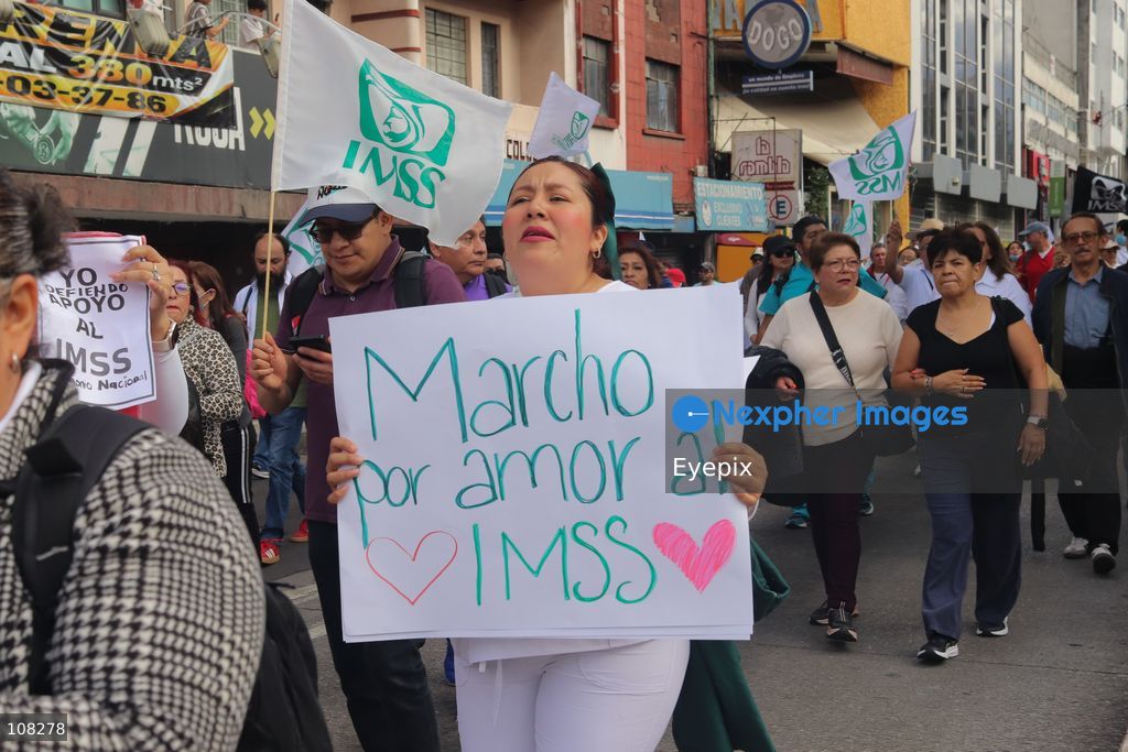 Healthcare workers belonging to the Mexican Social Security Institute (IMSS) protest to demand a direct pay raise based on the pay scale, a comprehensive supply of medical equipment and supplies, and the resignation of the General Secretary of the National Union of Social Security Workers (SNTSS). on October 21, 2026 in Mexico City, Mexico. (Photo by Carlos Santiago / Eyepix Group/Eyepix via Nexpher Images)