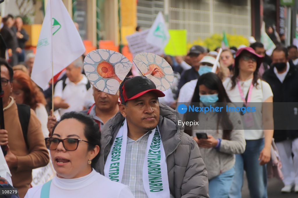 Healthcare workers belonging to the Mexican Social Security Institute (IMSS) protest to demand a direct pay raise based on the pay scale, a comprehensive supply of medical equipment and supplies, and the resignation of the General Secretary of the National Union of Social Security Workers (SNTSS). on October 21, 2026 in Mexico City, Mexico. (Photo by Carlos Santiago / Eyepix Group/Eyepix via Nexpher Images)