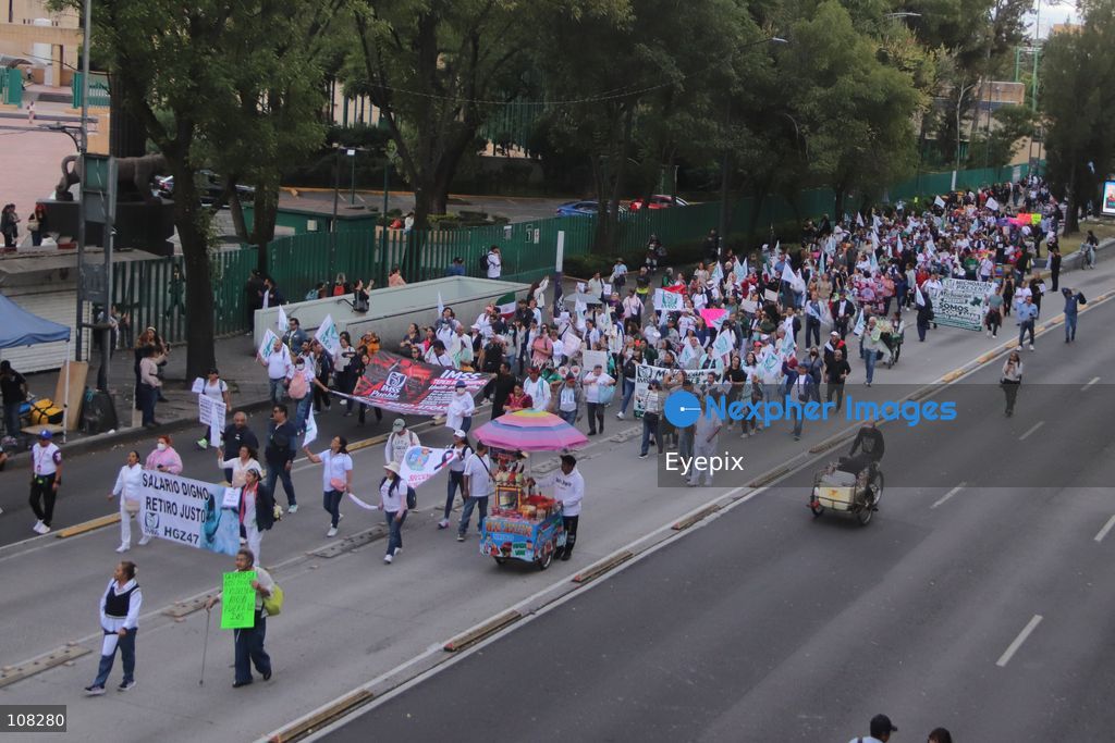 Healthcare workers belonging to the Mexican Social Security Institute (IMSS) protest to demand a direct pay raise based on the pay scale, a comprehensive supply of medical equipment and supplies, and the resignation of the General Secretary of the National Union of Social Security Workers (SNTSS). on October 21, 2026 in Mexico City, Mexico. (Photo by Carlos Santiago / Eyepix Group/Eyepix via Nexpher Images)
