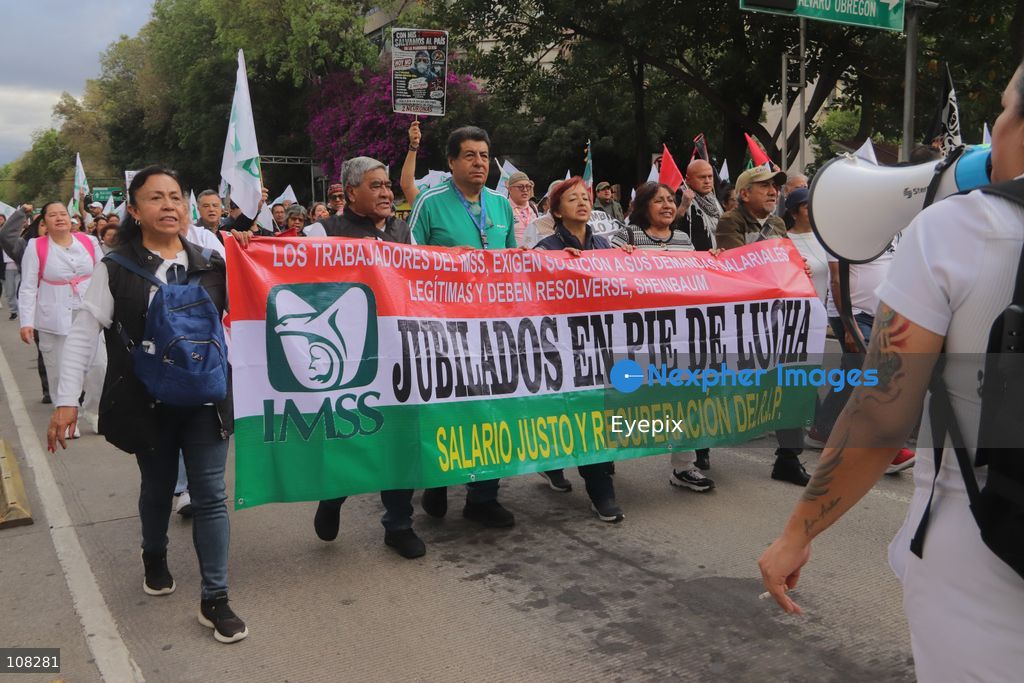 Healthcare workers belonging to the Mexican Social Security Institute (IMSS) protest to demand a direct pay raise based on the pay scale, a comprehensive supply of medical equipment and supplies, and the resignation of the General Secretary of the National Union of Social Security Workers (SNTSS). on October 21, 2026 in Mexico City, Mexico. (Photo by Carlos Santiago / Eyepix Group/Eyepix via Nexpher Images)