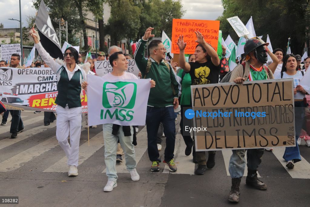 Healthcare workers belonging to the Mexican Social Security Institute (IMSS) protest to demand a direct pay raise based on the pay scale, a comprehensive supply of medical equipment and supplies, and the resignation of the General Secretary of the National Union of Social Security Workers (SNTSS). on October 21, 2026 in Mexico City, Mexico. (Photo by Carlos Santiago / Eyepix Group/Eyepix via Nexpher Images)
