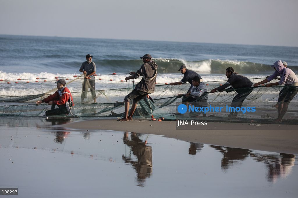 WADI GAZA, PALESTINE, OCTOBER 22, 2026: Palestinian fishermen fish near the mouth of Wadi Gaza in the central Gaza Strip as they seek to earn a living amid Israeli restrictions on fishing and deteriorating economic conditions. Damage to sewage infrastructure and the discharge of untreated wastewater into the sea have compounded environmental concerns along Gaza’s coast, adding to the difficulties facing fishing communities. (Photo by Ramzi Abu Amer/JNA Press via Nexpher Images)