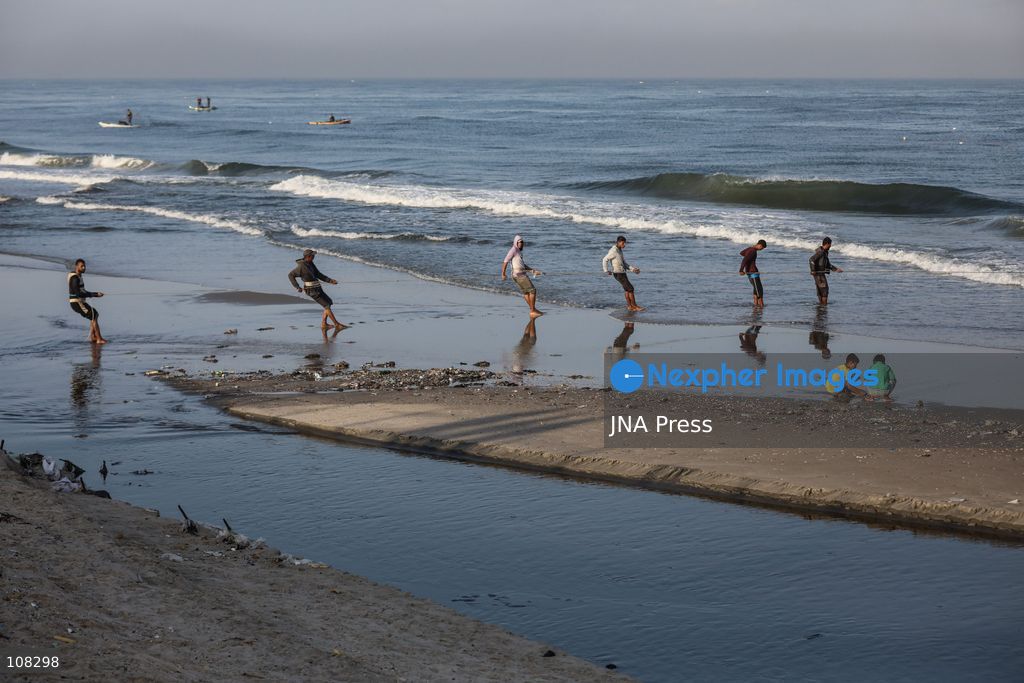 WADI GAZA, PALESTINE, OCTOBER 22, 2026: Palestinian fishermen fish near the mouth of Wadi Gaza in the central Gaza Strip as they seek to earn a living amid Israeli restrictions on fishing and deteriorating economic conditions. Damage to sewage infrastructure and the discharge of untreated wastewater into the sea have compounded environmental concerns along Gaza’s coast, adding to the difficulties facing fishing communities. (Photo by Ramzi Abu Amer/JNA Press via Nexpher Images)