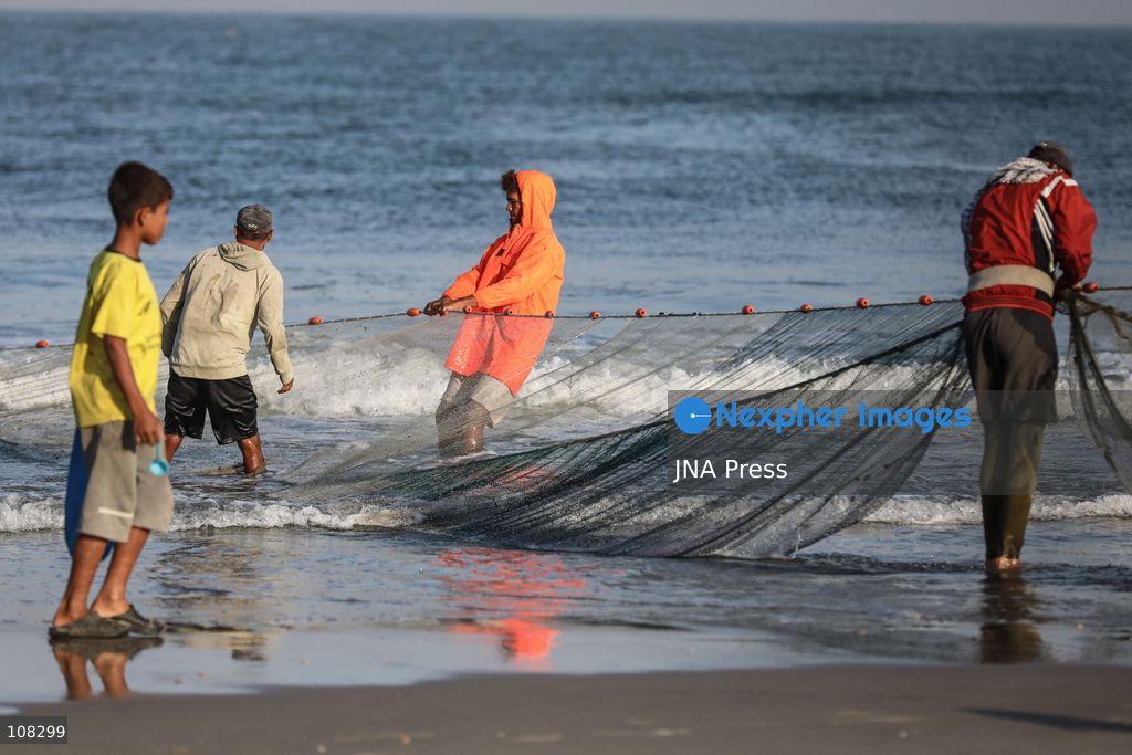 WADI GAZA, PALESTINE, OCTOBER 22, 2026: Palestinian fishermen fish near the mouth of Wadi Gaza in the central Gaza Strip as they seek to earn a living amid Israeli restrictions on fishing and deteriorating economic conditions. Damage to sewage infrastructure and the discharge of untreated wastewater into the sea have compounded environmental concerns along Gaza’s coast, adding to the difficulties facing fishing communities. (Photo by Ramzi Abu Amer/JNA Press via Nexpher Images)