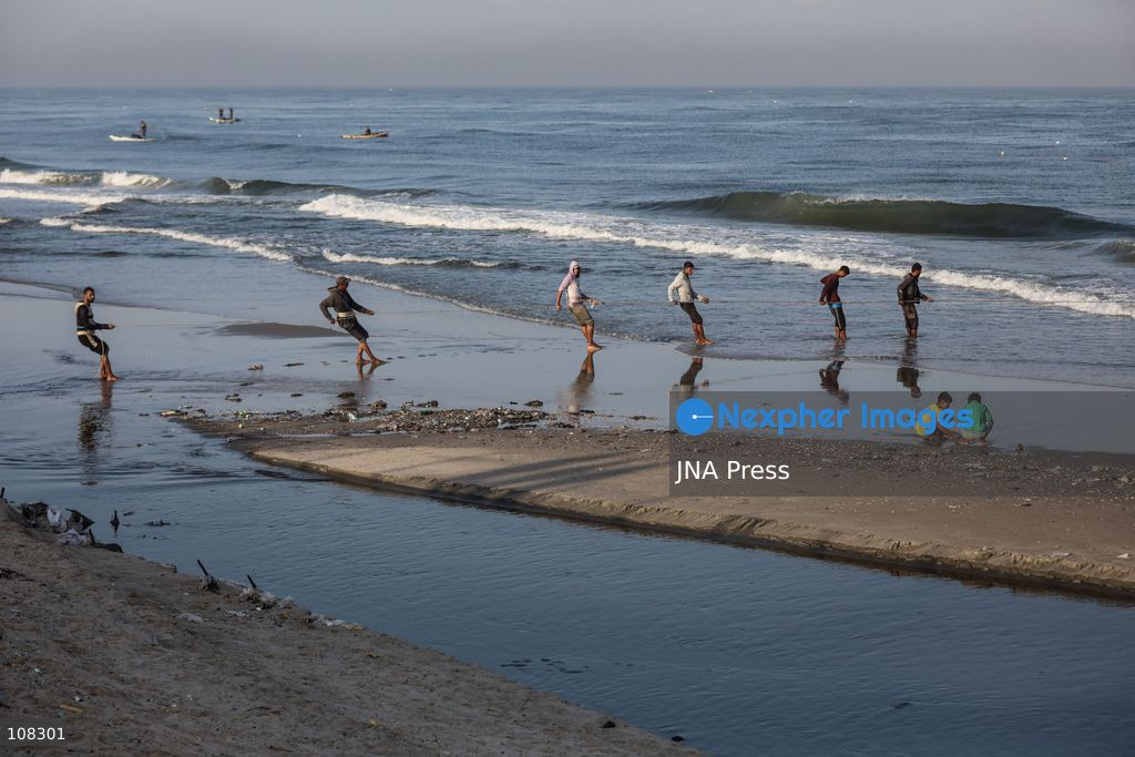 WADI GAZA, PALESTINE, OCTOBER 22, 2026: Palestinian fishermen fish near the mouth of Wadi Gaza in the central Gaza Strip as they seek to earn a living amid Israeli restrictions on fishing and deteriorating economic conditions. Damage to sewage infrastructure and the discharge of untreated wastewater into the sea have compounded environmental concerns along Gaza’s coast, adding to the difficulties facing fishing communities. (Photo by Ramzi Abu Amer/JNA Press via Nexpher Images)