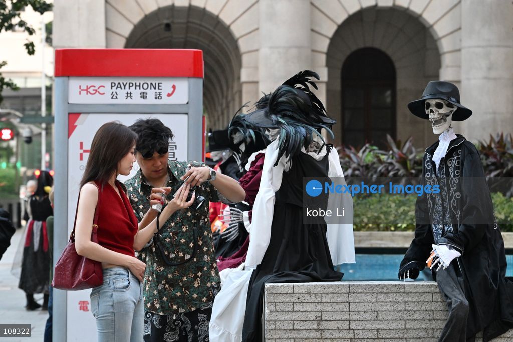 People posing photo with Halloween decorations at Central on October 22, 2026 in Hong Kong. (Photo by kobe Li/Nexpher Images)
