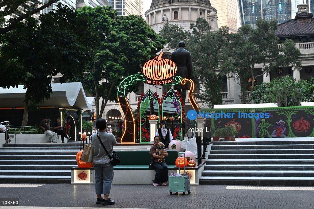 People posing photo with Halloween decorations at Central on October 22, 2026 in Hong Kong. (Photo by kobe Li/Nexpher Images)