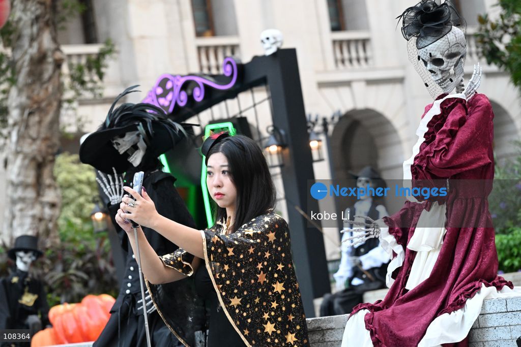 A lady posing photo with Halloween decorations at Central on October 22, 2026 in Hong Kong. (Photo by kobe Li/Nexpher Images)