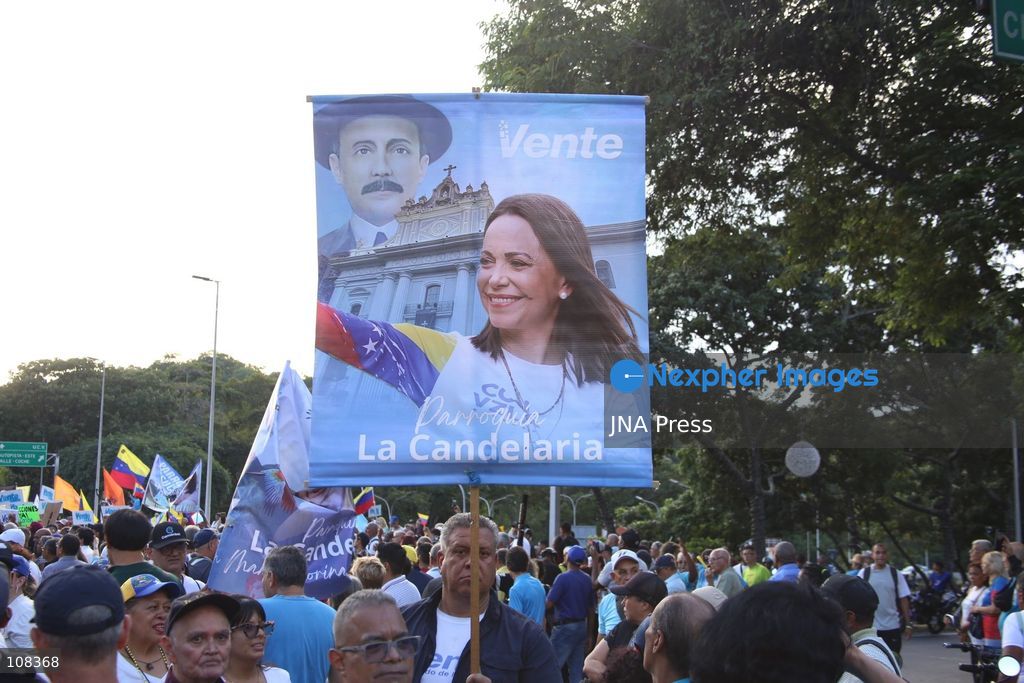 CARACAS, VENEZUELA, OCTOBER 22, 2026: Opposition supporters demonstrate in Caracas to demand a timetable for presidential elections and the safe return of opposition leader Maria Corina Machado to Venezuela. The rally forms part of nationwide mobilisations called by her Vente Venezuela movement, also demanding the release of political prisoners. (Photo by Moisés Quintero/JNA Press via Nexpher Images)