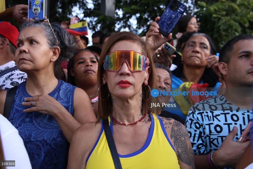 CARACAS, VENEZUELA, OCTOBER 22, 2026: Opposition supporters demonstrate in Caracas to demand a timetable for presidential elections and the safe return of opposition leader Maria Corina Machado to Venezuela. The rally forms part of nationwide mobilisations called by her Vente Venezuela movement, also demanding the release of political prisoners. (Photo by Moisés Quintero/JNA Press via Nexpher Images)