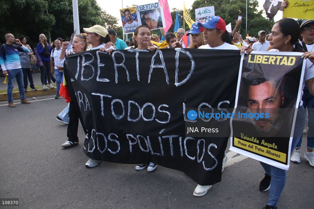 CARACAS, VENEZUELA, OCTOBER 22, 2026: Opposition supporters demonstrate in Caracas to demand a timetable for presidential elections and the safe return of opposition leader Maria Corina Machado to Venezuela. The rally forms part of nationwide mobilisations called by her Vente Venezuela movement, also demanding the release of political prisoners. (Photo by Moisés Quintero/JNA Press via Nexpher Images)