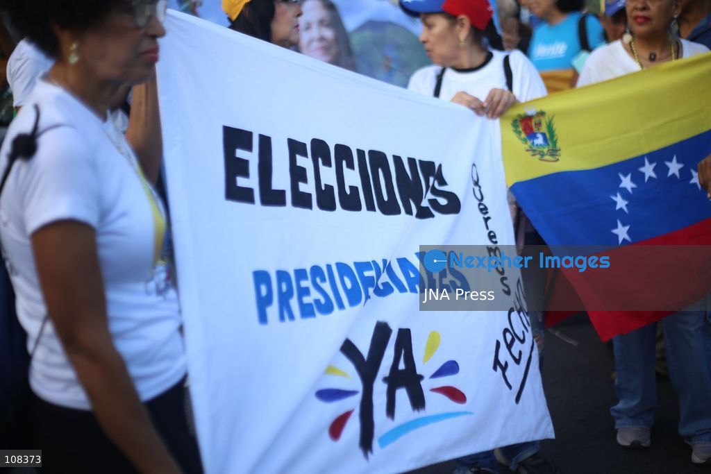 CARACAS, VENEZUELA, OCTOBER 22, 2026: Opposition supporters demonstrate in Caracas to demand a timetable for presidential elections and the safe return of opposition leader Maria Corina Machado to Venezuela. The rally forms part of nationwide mobilisations called by her Vente Venezuela movement, also demanding the release of political prisoners. (Photo by MoisÃ©s Quintero/JNA Press via Nexpher Images)