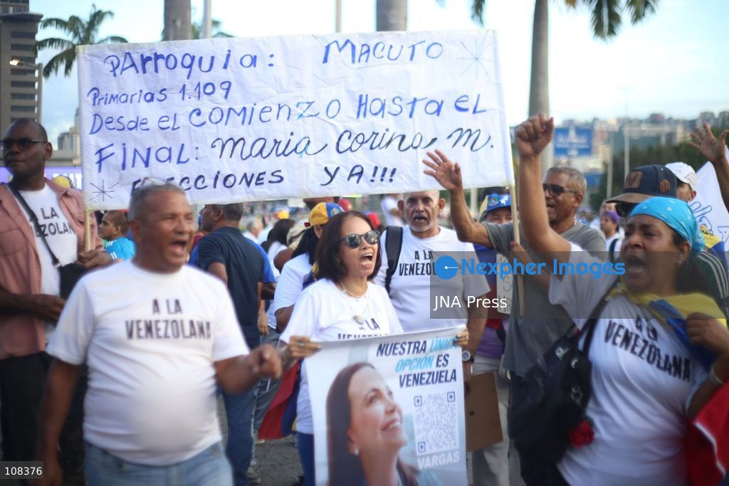 CARACAS, VENEZUELA, OCTOBER 22, 2026: Opposition supporters demonstrate in Caracas to demand a timetable for presidential elections and the safe return of opposition leader Maria Corina Machado to Venezuela. The rally forms part of nationwide mobilisations called by her Vente Venezuela movement, also demanding the release of political prisoners. (Photo by Moisés Quintero/JNA Press via Nexpher Images)