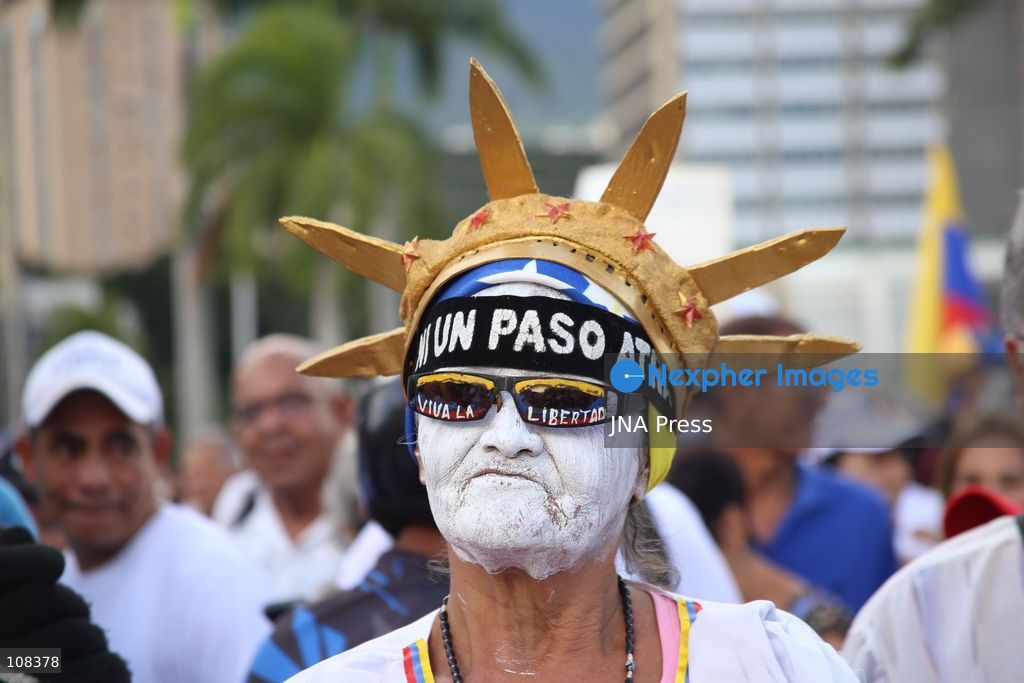CARACAS, VENEZUELA, OCTOBER 22, 2026: Opposition supporters demonstrate in Caracas to demand a timetable for presidential elections and the safe return of opposition leader Maria Corina Machado to Venezuela. The rally forms part of nationwide mobilisations called by her Vente Venezuela movement, also demanding the release of political prisoners. (Photo by MoisÃ©s Quintero/JNA Press via Nexpher Images)