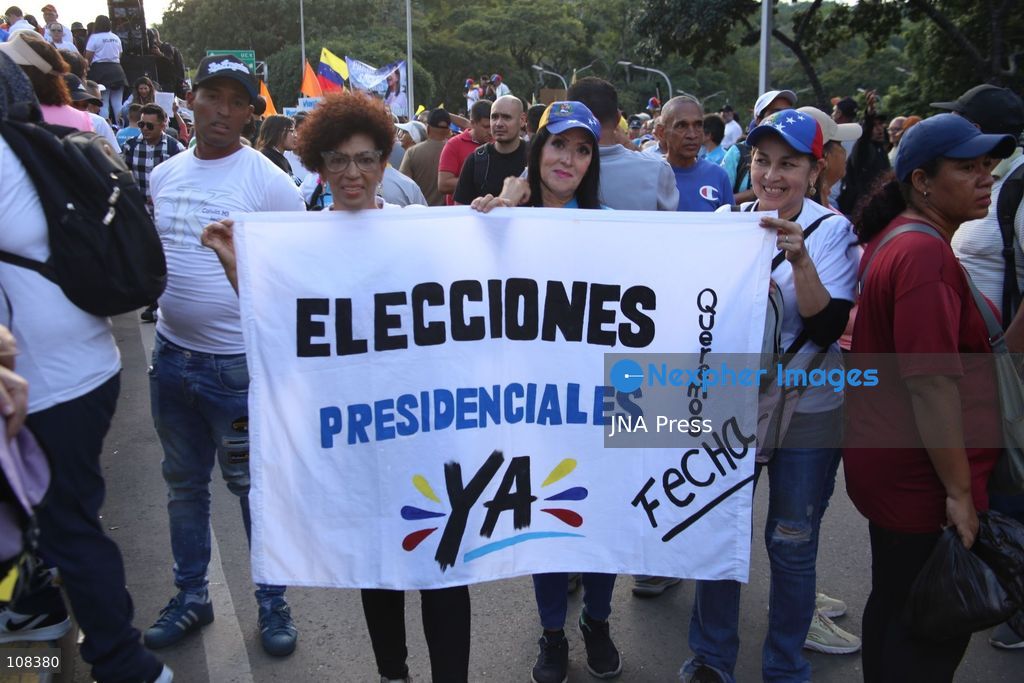 CARACAS, VENEZUELA, OCTOBER 22, 2026: Opposition supporters demonstrate in Caracas to demand a timetable for presidential elections and the safe return of opposition leader Maria Corina Machado to Venezuela. The rally forms part of nationwide mobilisations called by her Vente Venezuela movement, also demanding the release of political prisoners. (Photo by Moisés Quintero/JNA Press via Nexpher Images)