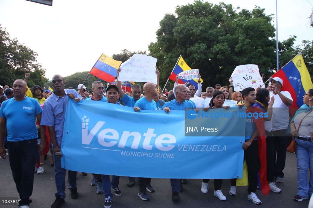 CARACAS, VENEZUELA, OCTOBER 22, 2026: Opposition supporters demonstrate in Caracas to demand a timetable for presidential elections and the safe return of opposition leader Maria Corina Machado to Venezuela. The rally forms part of nationwide mobilisations called by her Vente Venezuela movement, also demanding the release of political prisoners. (Photo by Moisés Quintero/JNA Press via Nexpher Images)