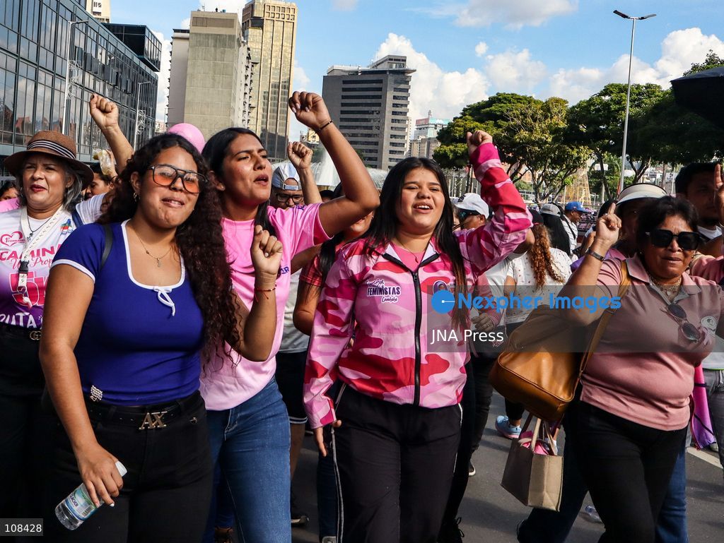 CARACAS, VENEZUELA, OCTOBER 22, 2026: Government supporters march from Plaza Venezuela towards Santa Capilla in central Caracas during a mobilisation marking Breast Cancer Awareness Month and honouring Venezuelan women. The march, called by the ruling United Socialist Party of Venezuela (PSUV), raises awareness of breast cancer and supports people affected by the disease. (Photo by Mario Flores/JNA Press via Nexpher Images)