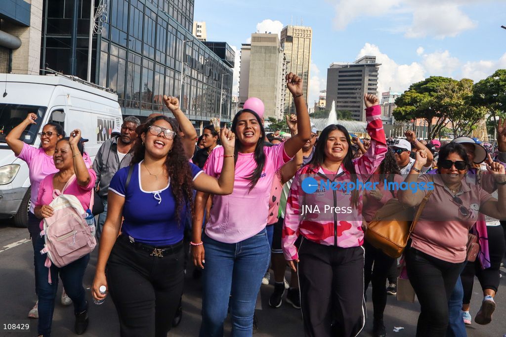 CARACAS, VENEZUELA, OCTOBER 22, 2026: Government supporters march from Plaza Venezuela towards Santa Capilla in central Caracas during a mobilisation marking Breast Cancer Awareness Month and honouring Venezuelan women. The march, called by the ruling United Socialist Party of Venezuela (PSUV), raises awareness of breast cancer and supports people affected by the disease. (Photo by Mario Flores/JNA Press via Nexpher Images)