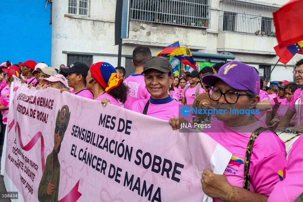 CARACAS, VENEZUELA, OCTOBER 22, 2026: Government supporters march from Plaza Venezuela towards Santa Capilla in central Caracas during a mobilisation marking Breast Cancer Awareness Month and honouring Venezuelan women. The march, called by the ruling United Socialist Party of Venezuela (PSUV), raises awareness of breast cancer and supports people affected by the disease. (Photo by Mario Flores/JNA Press via Nexpher Images)