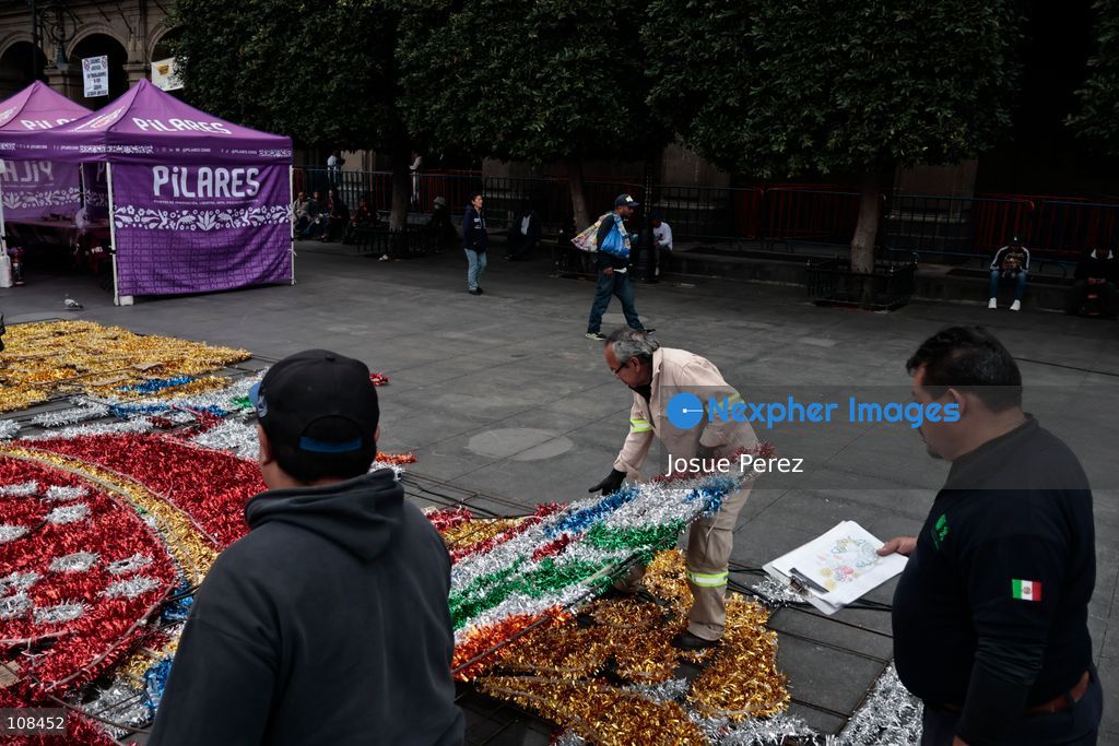 City workers begin assembling on the ground the installation that will be placed on buildings to celebrate the Day of the Dead, on October 22, 2026, in Mexico City, Mexico. Construction crews working for the Mexico City government have begun assembling and installing the structures that will illuminate the buildings surrounding the city’s Zócalo. Using cranes, cables, and various framework components, they are preparing everything for the unveiling of the Monumental Ofrenda (altar), which will feature the world’s tallest Catrina, so that both locals and tourists can enjoy the start of the Day of the Dead celebrations in Mexico. (Photo by Josue Perez/Nexpher Images)