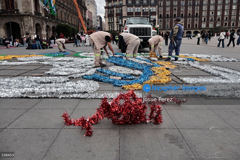 City workers begin assembling on the ground the installation that will be placed on buildings to celebrate the Day of the Dead, on October 22, 2026, in Mexico City, Mexico. Construction crews working for the Mexico City government have begun assembling and installing the structures that will illuminate the buildings surrounding the city’s Zócalo. Using cranes, cables, and various framework components, they are preparing everything for the unveiling of the Monumental Ofrenda (altar), which will feature the world’s tallest Catrina, so that both locals and tourists can enjoy the start of the Day of the Dead celebrations in Mexico. (Photo by Josue Perez/Nexpher Images)