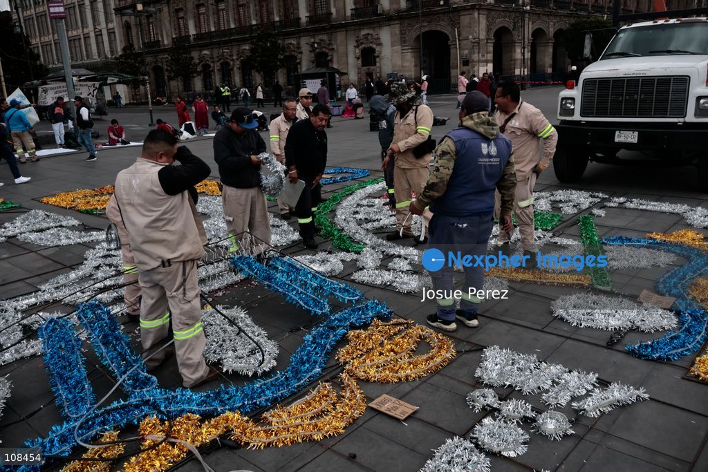 City workers begin assembling on the ground the installation that will be placed on buildings to celebrate the Day of the Dead, on October 22, 2026, in Mexico City, Mexico. Construction crews working for the Mexico City government have begun assembling and installing the structures that will illuminate the buildings surrounding the city’s Zócalo. Using cranes, cables, and various framework components, they are preparing everything for the unveiling of the Monumental Ofrenda (altar), which will feature the world’s tallest Catrina, so that both locals and tourists can enjoy the start of the Day of the Dead celebrations in Mexico. (Photo by Josue Perez/Nexpher Images)