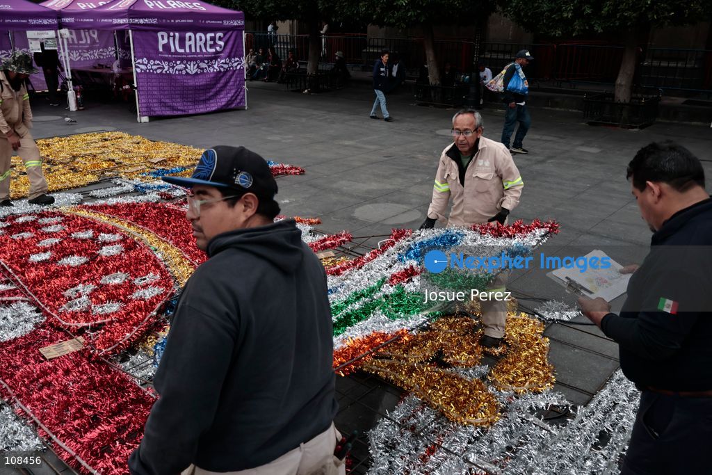 City workers begin assembling on the ground the installation that will be placed on buildings to celebrate the Day of the Dead, on October 22, 2026, in Mexico City, Mexico. Construction crews working for the Mexico City government have begun assembling and installing the structures that will illuminate the buildings surrounding the city’s Zócalo. Using cranes, cables, and various framework components, they are preparing everything for the unveiling of the Monumental Ofrenda (altar), which will feature the world’s tallest Catrina, so that both locals and tourists can enjoy the start of the Day of the Dead celebrations in Mexico. (Photo by Josue Perez/Nexpher Images)